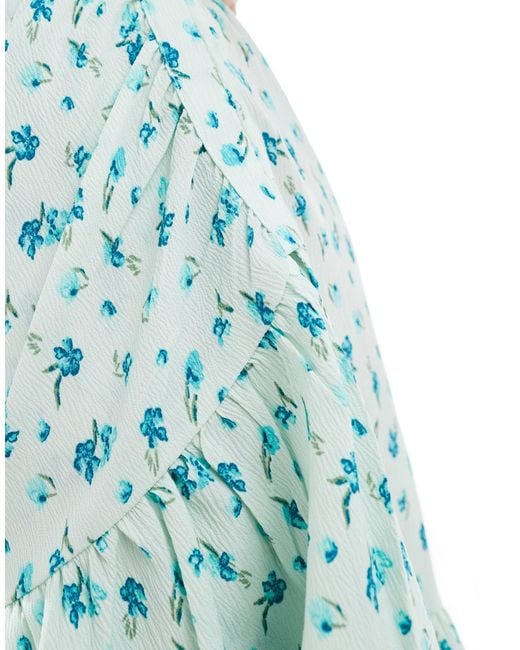 Robe courte portefeuille à fleurs - bleu clair Vero Moda en coloris Blue