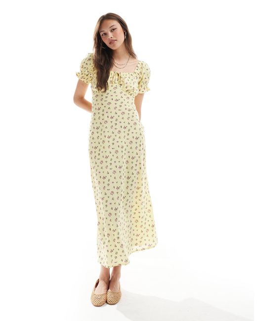Robe mi-longue tendance folk à fleurs New Look en coloris White