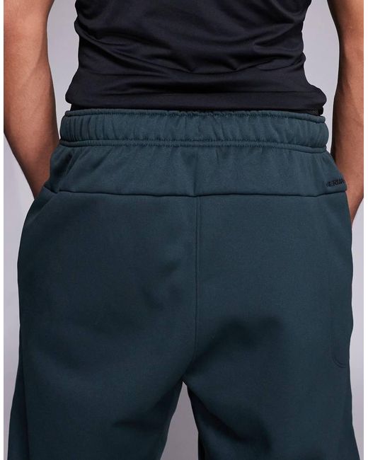Nike Blue Therma Tapered Trousers for men
