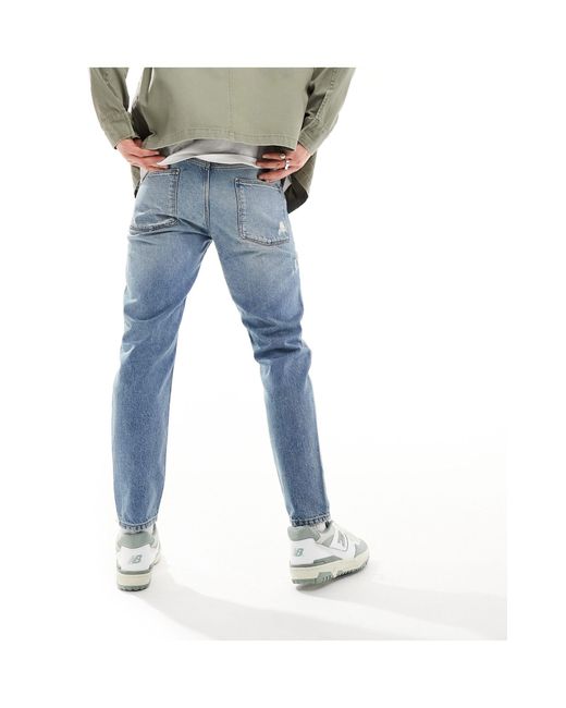 Jeans rigidi modello classico lavaggio chiaro con strappi di ASOS in Blue da Uomo