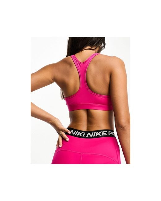 Nike Swoosh Dri-fit Light Support Sports Bra in Pink
