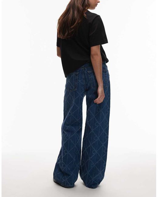 Calvin Klein Blue Laser Cut Repeat Logo Low Rise baggy Jeans