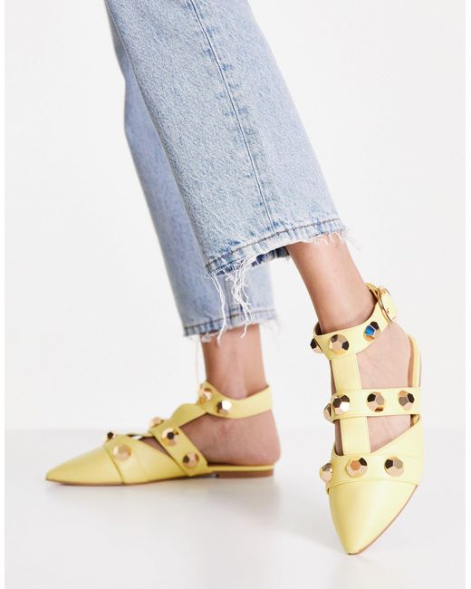 yellow studded flats