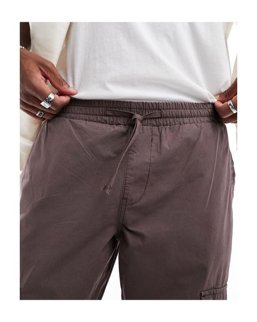 Pantaloni cargo affusolati scuro slavato con vita elasticizzata di ASOS in Brown da Uomo