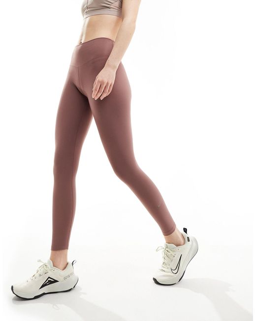 Nike - one training dri-fit - leggings alla caviglia a vita medio alta malva fumé di Nike in Brown