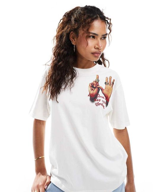 Camiseta Blanca Con Estampado Gráfico De Anillos En La Espalda De Nike de color White
