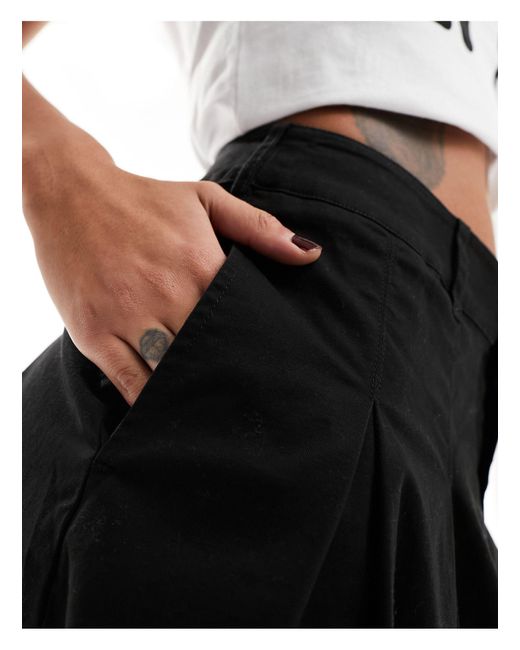 Falda negra plisada por la rodilla ASOS de color Black