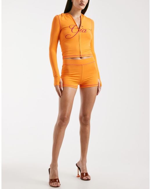 I.AM.GIA Orange Blare Logo Back Print Contrast Stitch Shorts