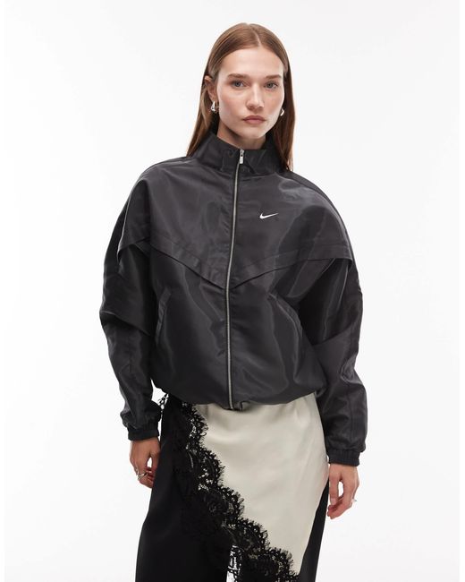 Windrunner liquid shine - veste Nike en coloris Blue