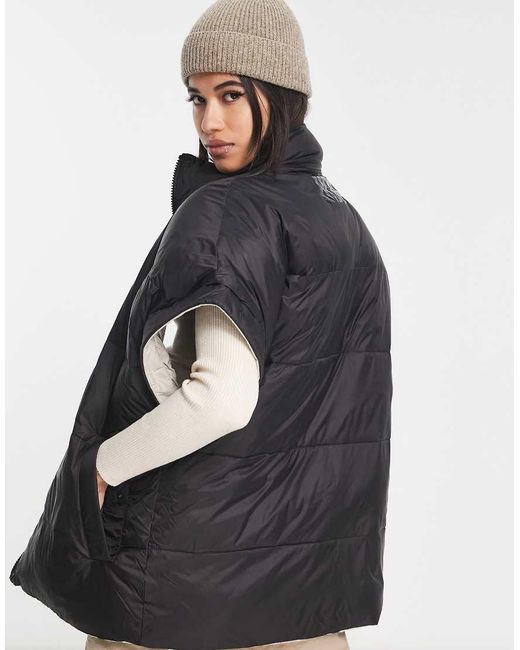 Chaleco De Plumas Negro Reversible Sydnee De Ugg de color Black