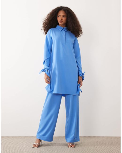 Chemise d'ensemble longue à détail boutonné Iyal en coloris Blue