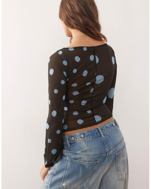 Reclaimed (vintage) Blue Slash Neck Flare Sleeve Top With Spliced Blurred Polka Dot Print