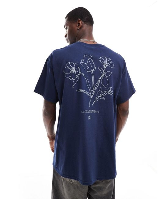 T-shirt oversize à imprimé fleurs au dos ASOS pour homme en coloris Blue