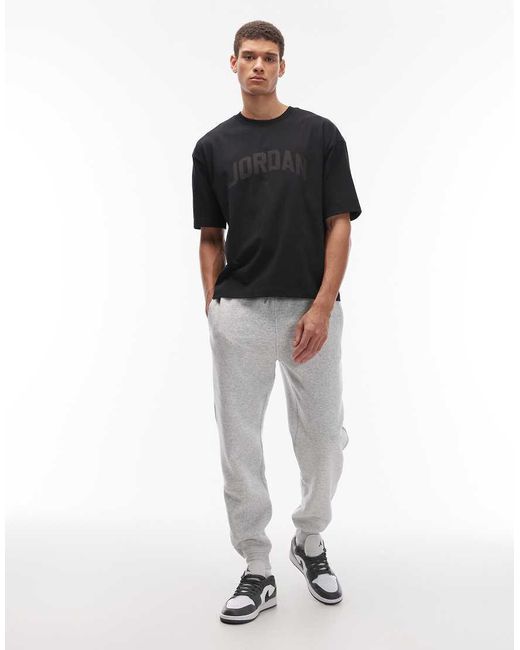 Joggers Grises Con Bajos Ajustados De Felpa De Nike de hombre de color Black