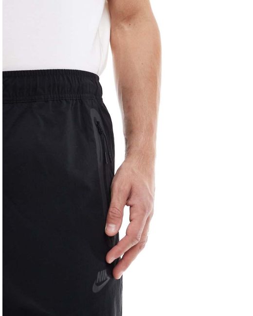 Nike Blue Tech Woven Open Hem Trousers for men