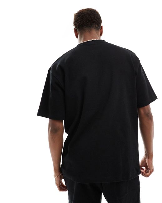 T-shirt nera testurizzata a nido d'ape di Pull&Bear in Black da Uomo