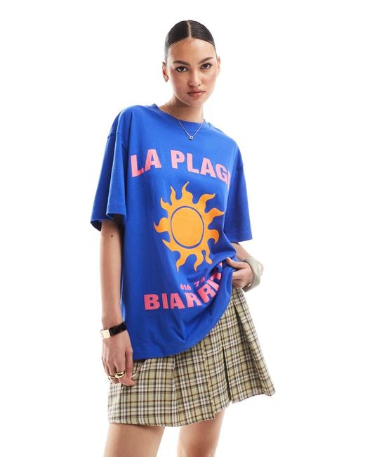 Camiseta Extragrande Con Estampado Gráfico De Sol Y Texto "La Plage" De Tejido Efecto Lino De ASOS de color Blue