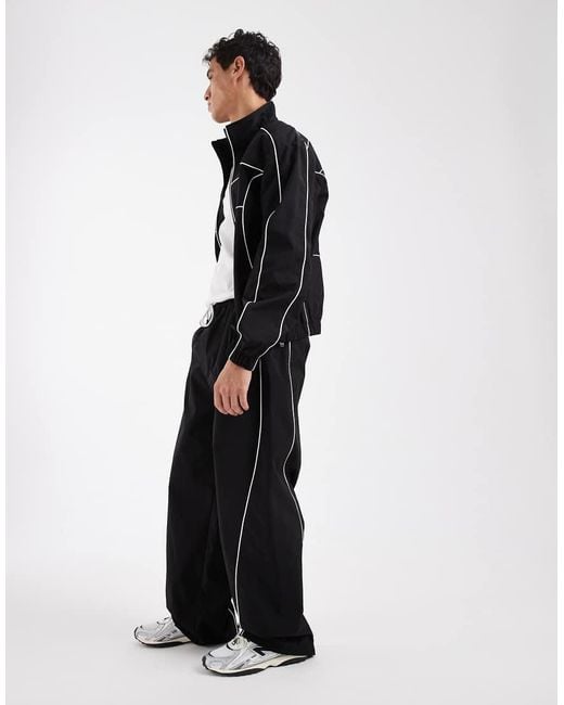 Tommy Hilfiger Black Theo Piping Detail Parachute Track Pants for men