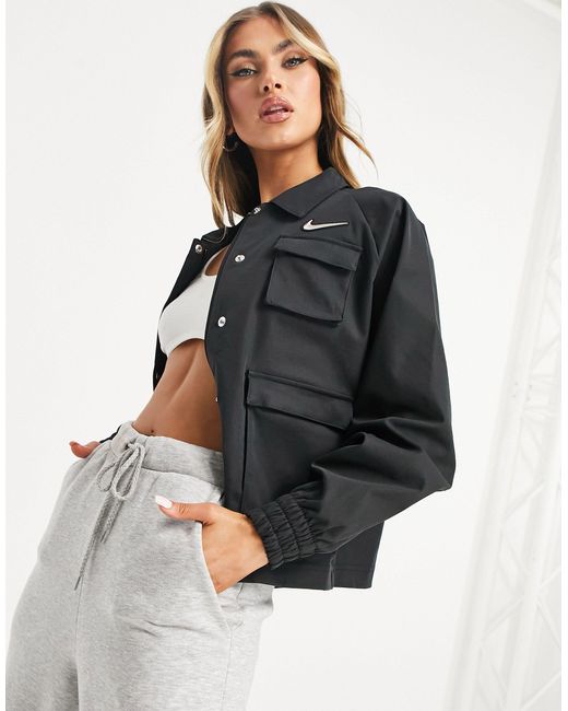 nike swoosh woven jacket with utility pockets