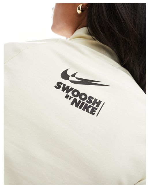 Chaqueta vela con cremallera y logo pequeño Nike de color White