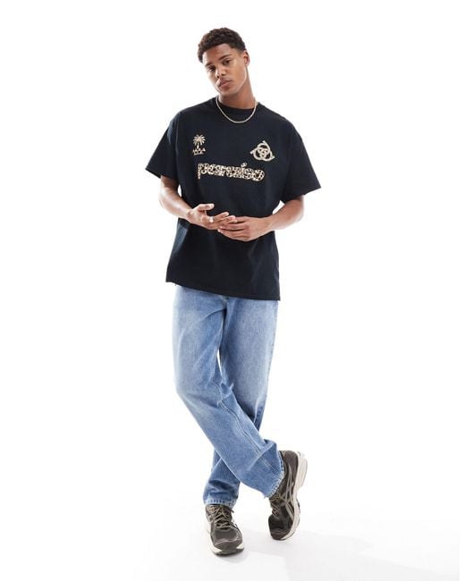 T-shirt oversize nera con stampa sportiva leopardata di ASOS in Blue da Uomo