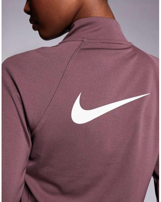 Nike Tempo in het Purple