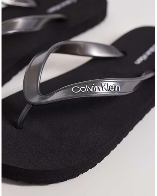 Calvin Klein Black Jeans Metallic Flip Flops