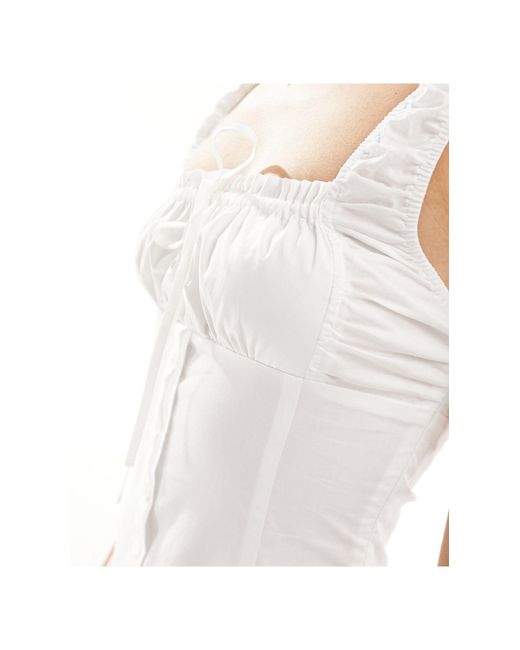 Vestito lungo stile milkmaid a balze di Lioness in White