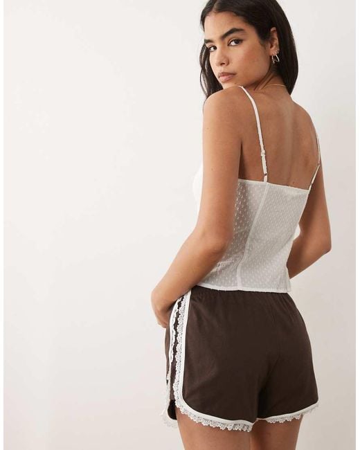 The Frolic White Exclusive Dobby Cotton Lace Trim Tie Front Cami Top