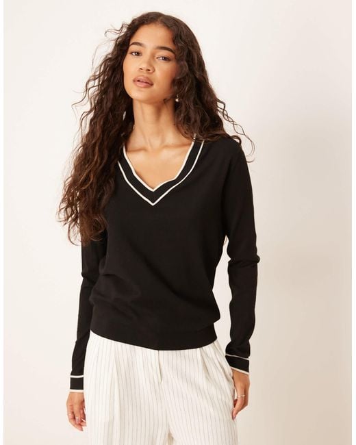 Pull en maille avec col en v et finitions contrastantes Mango en coloris Black