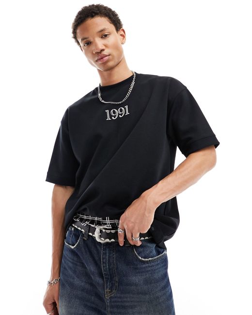 T-shirt nera con stampa 1991 di Pull&Bear in Black da Uomo