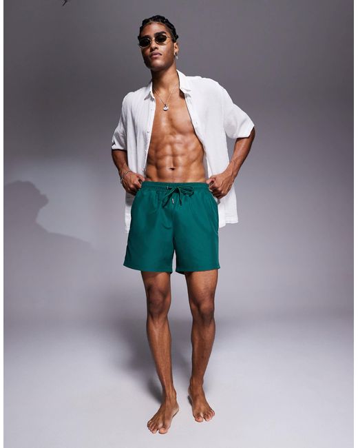 The Couture Club Green Reactive Emblem Swim Shorts for men