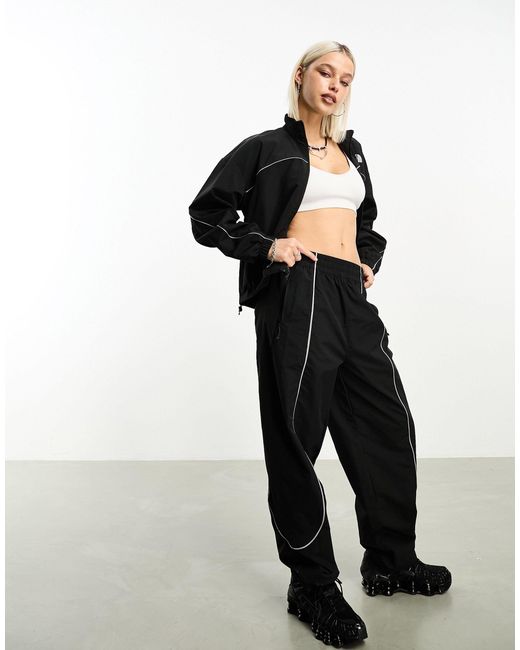 The North Face Black Tek Woven Track Pants With Reflective Piping