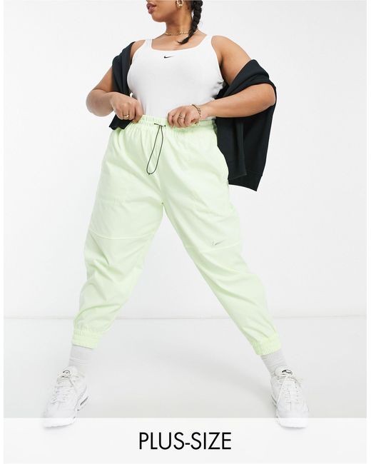 Plus - pantalon tissé à logo virgule - fluo Nike en coloris Jaune | Lyst