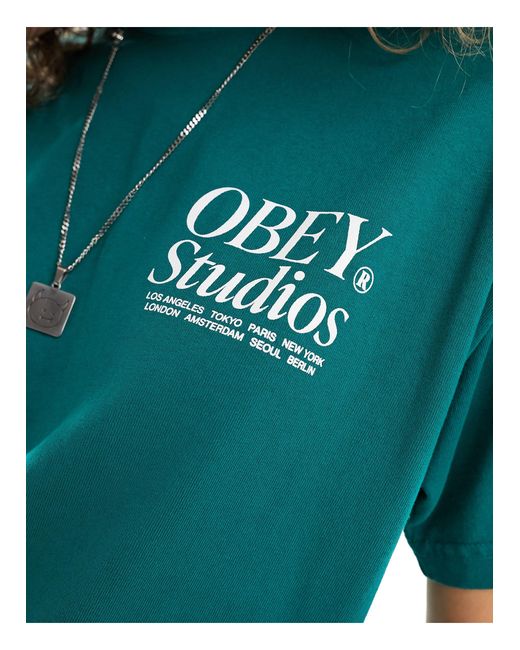 T-shirt unisex pesante con stampa "studios" di Obey in Blue