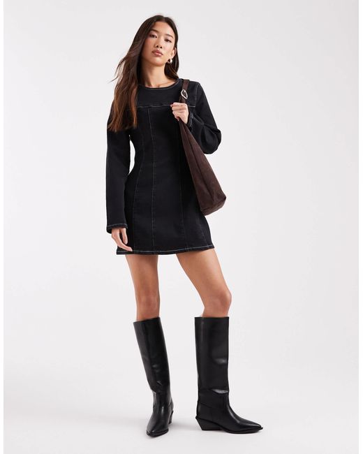 Robe courte structurée en jean avec taille cintrée et manches longues ASOS en coloris Black