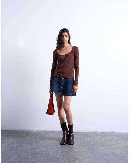 Minifalda Vaquera Azul Añil Enjuagado Con Botones De TOPSHOP de color Blue