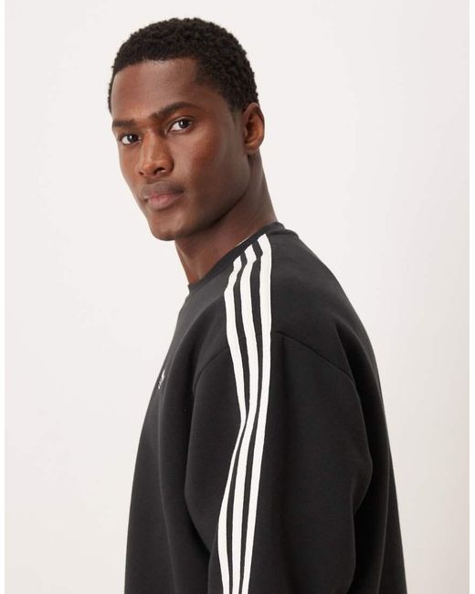 Adidas Originals Black Three Stripe Oversized Sweatshirt for men