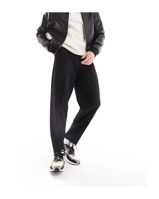 Pantalon habillé oversize fuselé ASOS pour homme en coloris Black