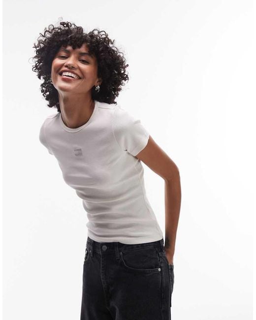 T-Shirt Slim Bianca A Coste Con Stemma Centrale di Tommy Hilfiger in White