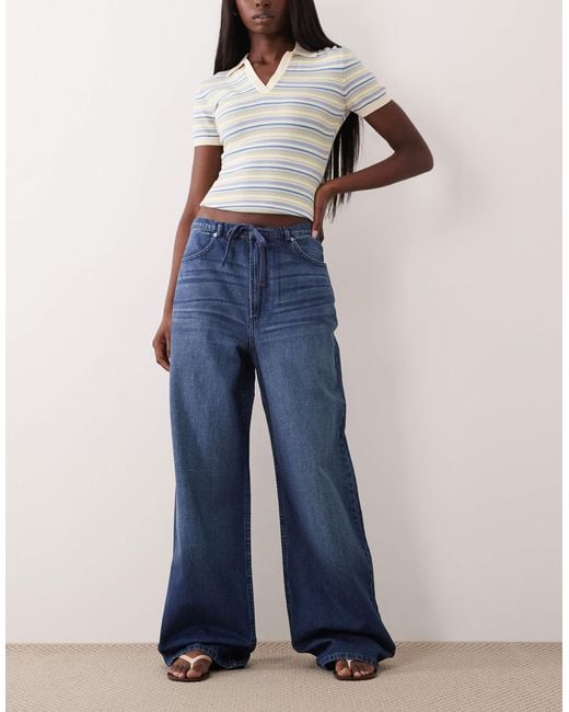 Jean large à enfiler - moyen délavé ASOS en coloris Blue