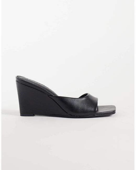 Raid Black Juniper mules mit keilabsatz