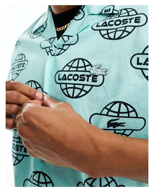 Lacsote - camicia a maniche corte con motivo grafico del logo di Lacoste in Blue da Uomo