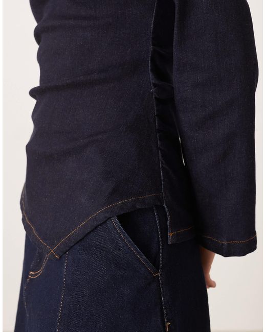 Top manches longues en denim à taille cintrée et épaulettes - brut délavé ASOS en coloris Blue