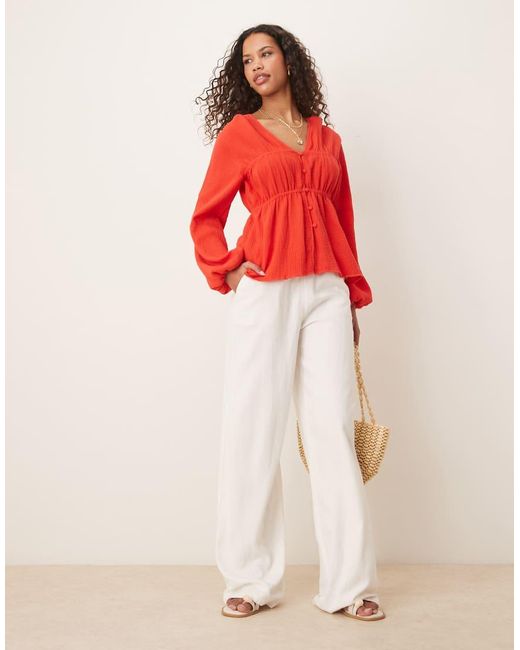 Top Punto Smock A Maniche Lunghe Con Bottoni Sul Davanti di ASOS in Red