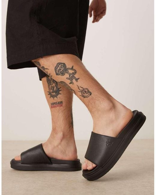 Calvin Klein Black Embossed Slider Sandals for men