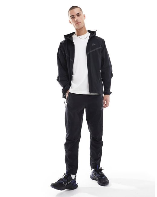 Nike Blue Tech Woven Open Hem Trousers for men