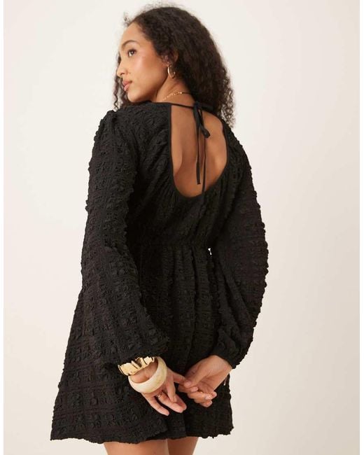 Gina Tricot Black Textured Mini Dress With Open Tie Back And Volume Sleeves