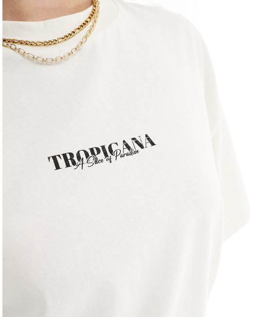 T-shirt boyfriend color crema con stampa tropicana sul retro di ASOS in White