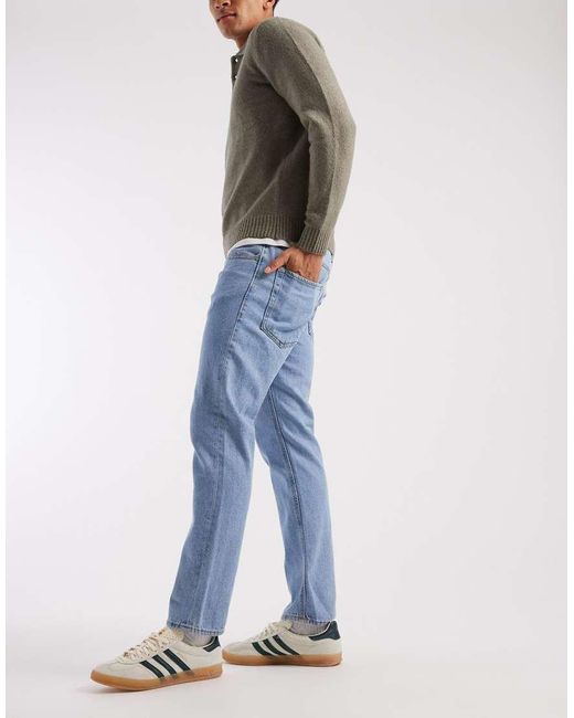 JJ Rebel Adam tapered jeans in black | ASOS